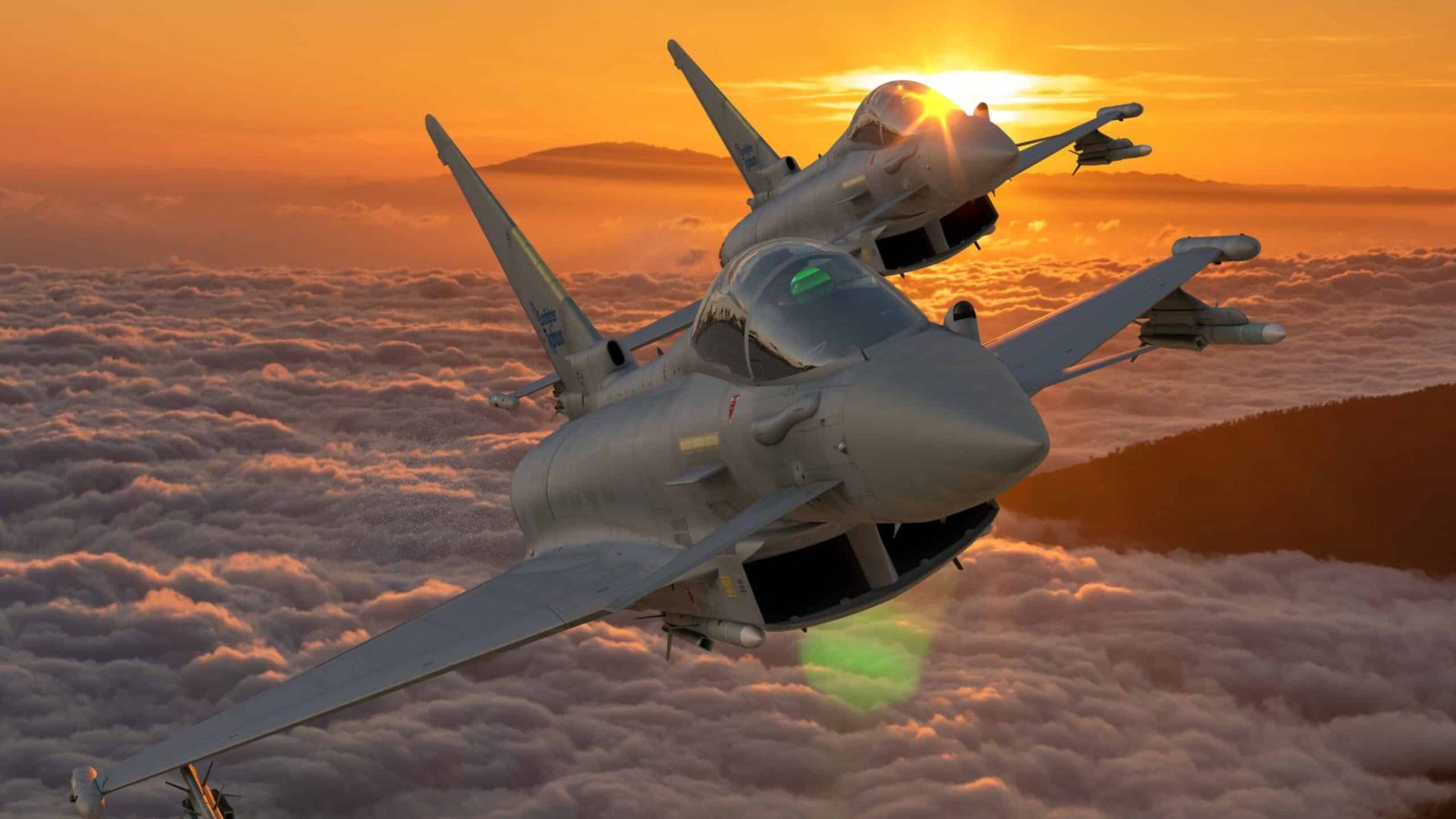 Fighter jets flying at sunset above clouds, showcasing advanced military aircraft in a striking sky scene.